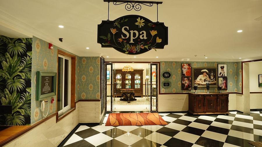 the entrance of the spa with a signboard hanging - Mayfair Tea Resort, Siliguri
