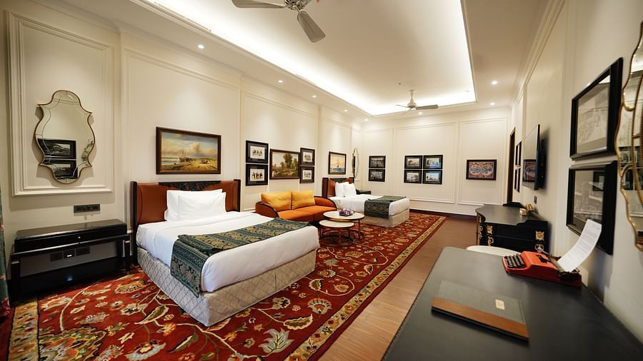Modern suite with a blend of classic and contemporary decor and dark furnishings.