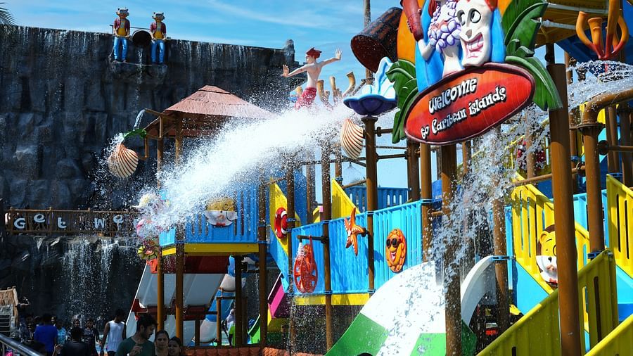 View of swimming pool with slides and spray bucket