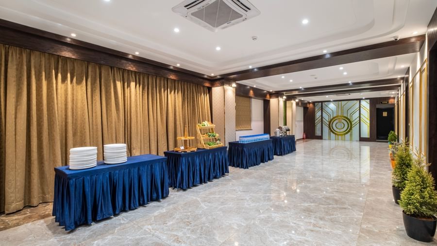 Spacious buffet counter at Monday Hotels Amalapuram Heights with modern decor.