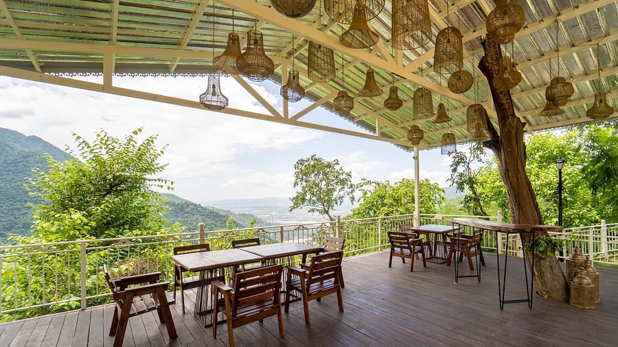 Restaurant with tables and chairs at Neer Ganga Resorts
