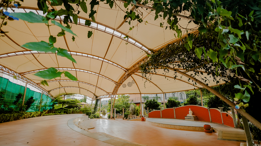 A view of the outdoor event space with the canopy and stage at Nirantara Resort & Spa.