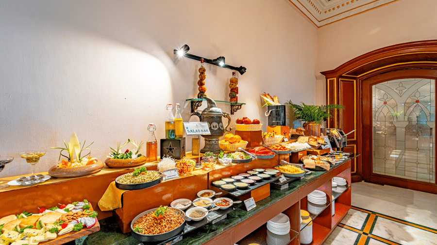 Wide-angle shot of the buffet counter with a diverse spread on display at the Marble Arch restaurant at Noor-Us-Sabah Palace, Bhopal.