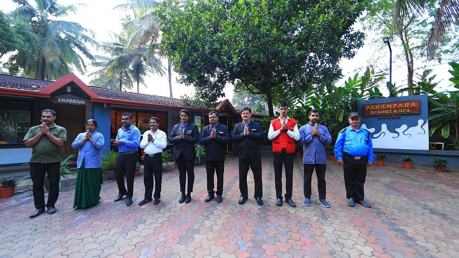 Image of a group of people posing for the lens at Parampara Resort & Spa, Kushalnagar.