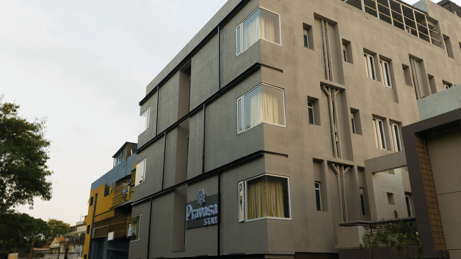 The modern multi-storey exterior facade of Pravasa Stay Bapat Square, Indore, featuring clean architectural lines.