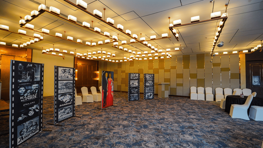 A wide-angle shot of an event space with rows of chairs and a few display boards, indicating a presentation or conference is about to begin | Pushkara Resort & Spa, Ajmer
