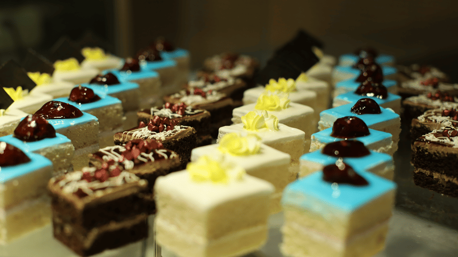 A vibrant display of assorted, brightly coloured petit fours and small cakes at the dessert bar in Pushkara Resort & Spa.