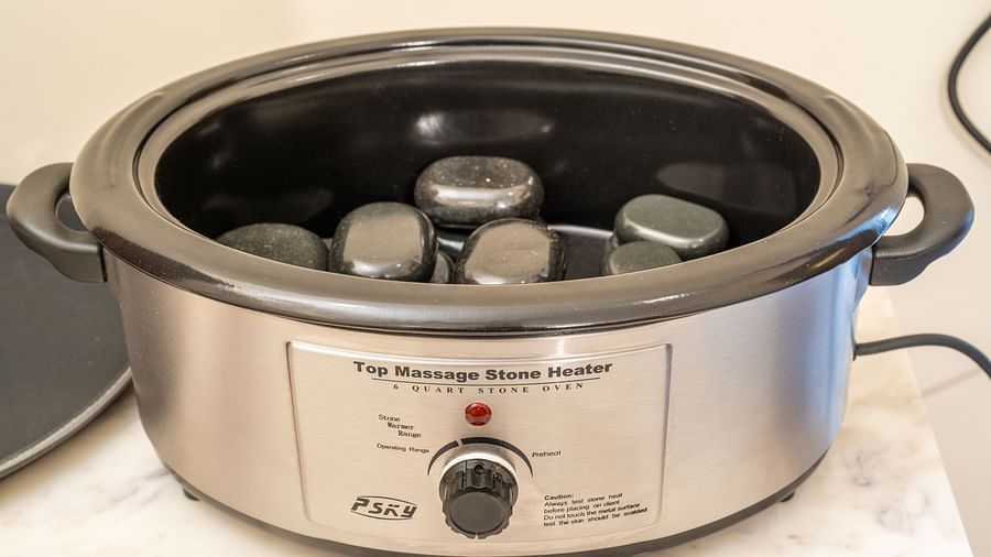 An image of an electric vessels where stones are placed - Rajbagh Wellness