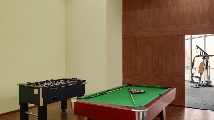 Indoor recreational activities like table soccer and billiards available in the Game Room at Ramada by Wyndham Bodh Gaya Mahabodhi.