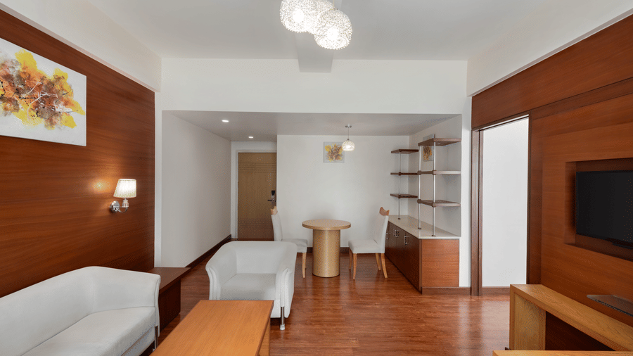 Living area of the King Suite at Ramada by Wyndham Bodh Gaya Mahabodhi displays the spacious layout and contemporary decor.