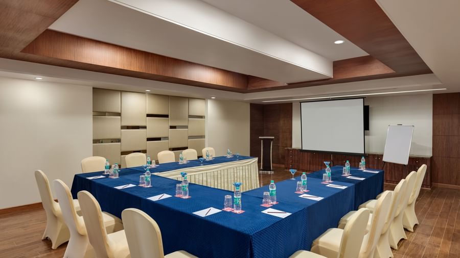 Board room with blue conference table and executive seating at Ramada by Wyndham Ghaziabad Vasundhara