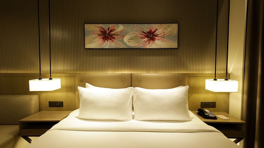 Cosy room with a king size bed and modern decor at Ramada by Wyndham Sonipat Murthal