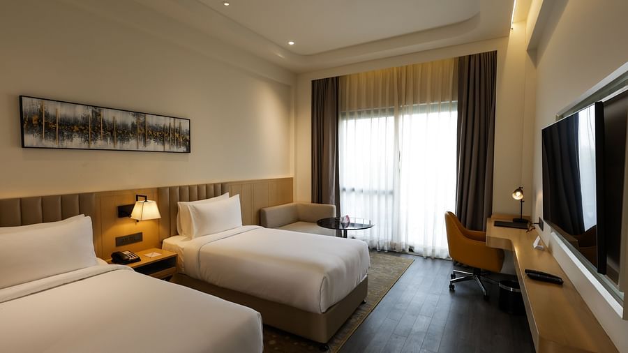 Room with ambient lighting and artwork at Ramada by Wyndham Sonipat Murthal