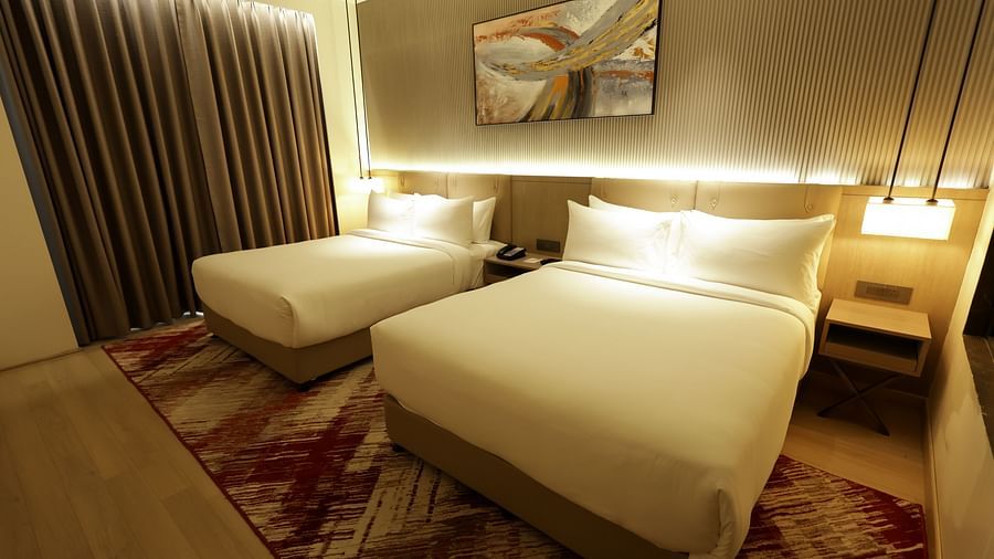 Room with soft lighting and warm tones for a relaxing stay at Ramada by Wyndham Sonipat Murthal