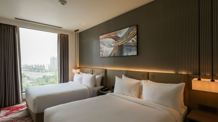 Bright room with a large window and scenic outdoor views at Ramada by Wyndham Sonipat Murthal