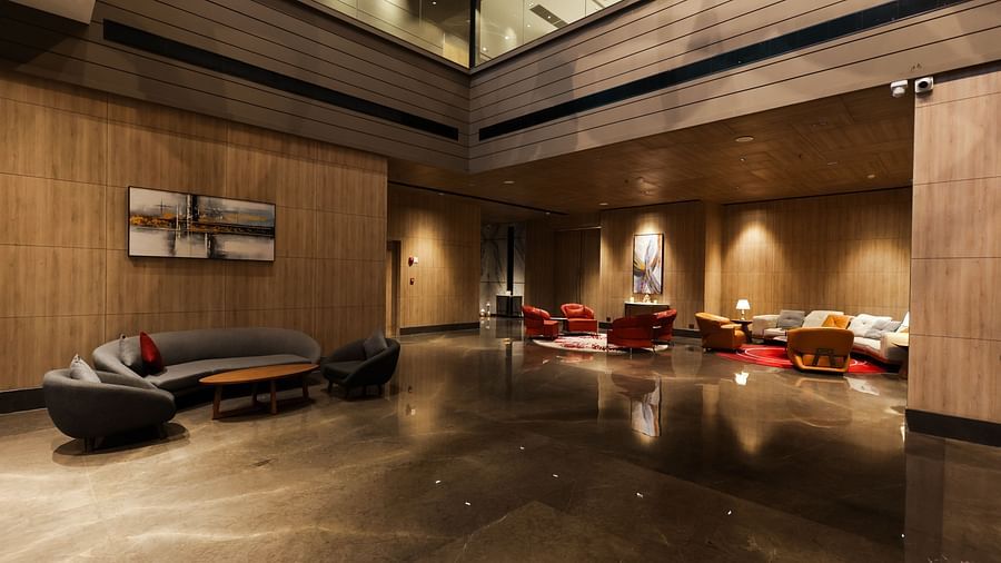 Spacious hotel lobby with modern seating and warm tones at Ramada by Wyndham Sonipat Murthal