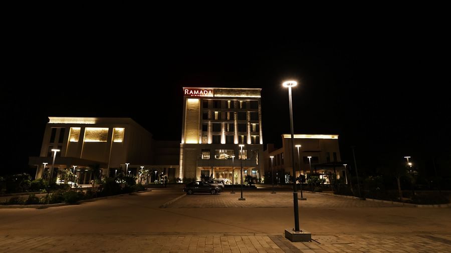 Evening front view of illuminated Ramada by Wyndham Sonipat Murthal facade
