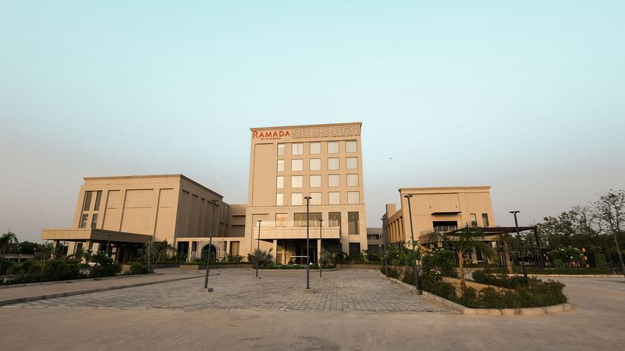 Wide-angle view of Ramada by Wyndham Sonipat Murthal exterior and landscaped entry