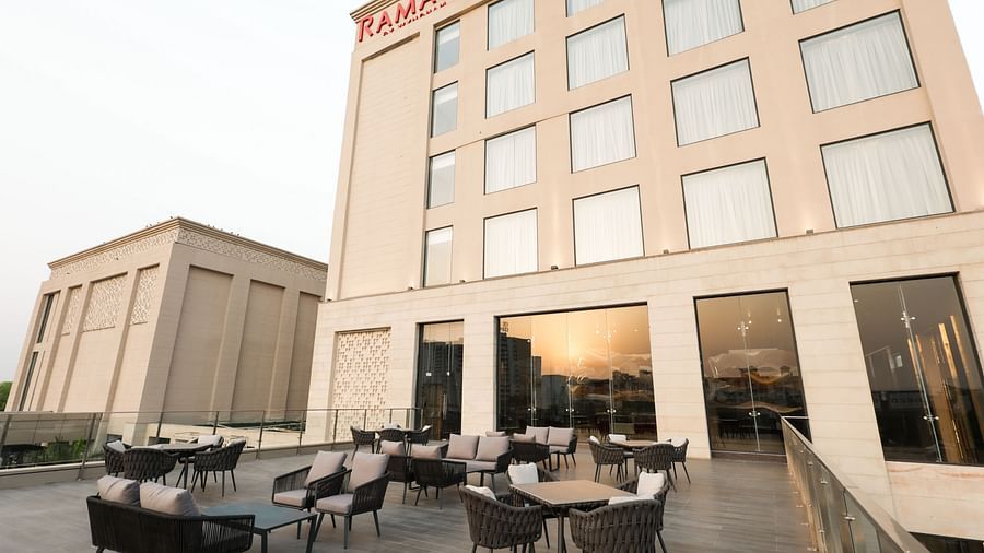 Outdoor seating area with modern furniture at Ramada by Wyndham Sonipat Murthal