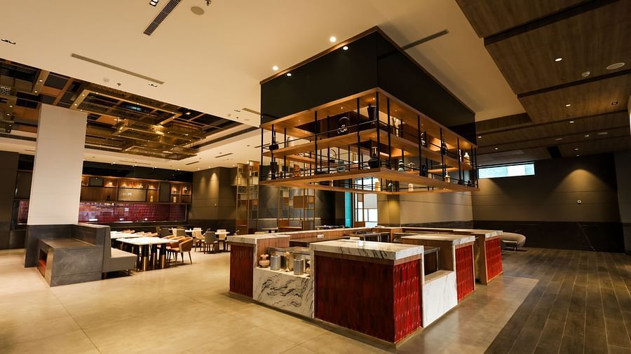 Buffet counter and open kitchen setup inside the restaurant at Ramada by Wyndham Sonipat Murthal