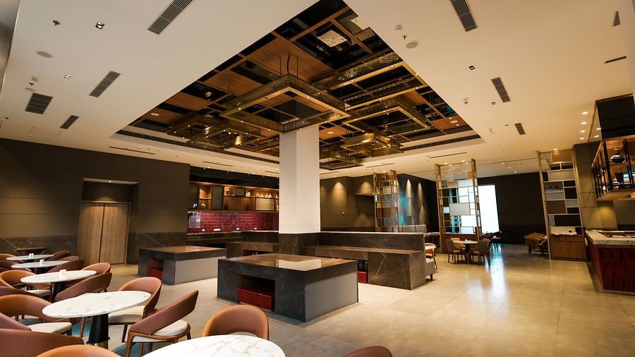 Indoor restaurant with contemporary decor and comfortable seating at Ramada by Wyndham Sonipat Murthal