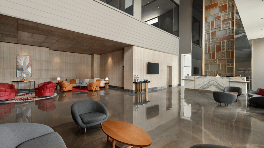 Stylish lobby lounge featuring comfortable seating, polished interiors, and contemporary decor at Ramada by Wyndham Sonipat Murthal.