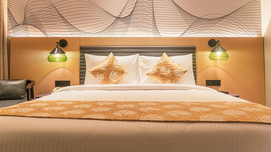 A king size bed of a room at Ramada Encore, Bhiwadi.