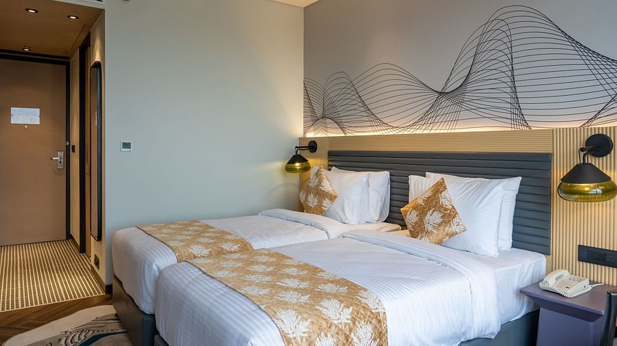 A king size bed of a room at Ramada Encore, Bhiwadi.