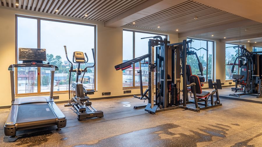 Gymnasium area with equipment at Ramada Encore, Bhiwadi.