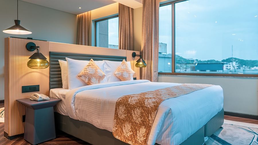 A king size bed of Junior Suite at Ramada Encore, Bhiwadi.