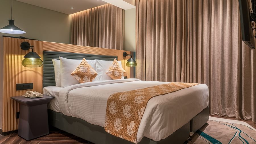 A king size bed of Junior Suite at Ramada Encore, Bhiwadi.