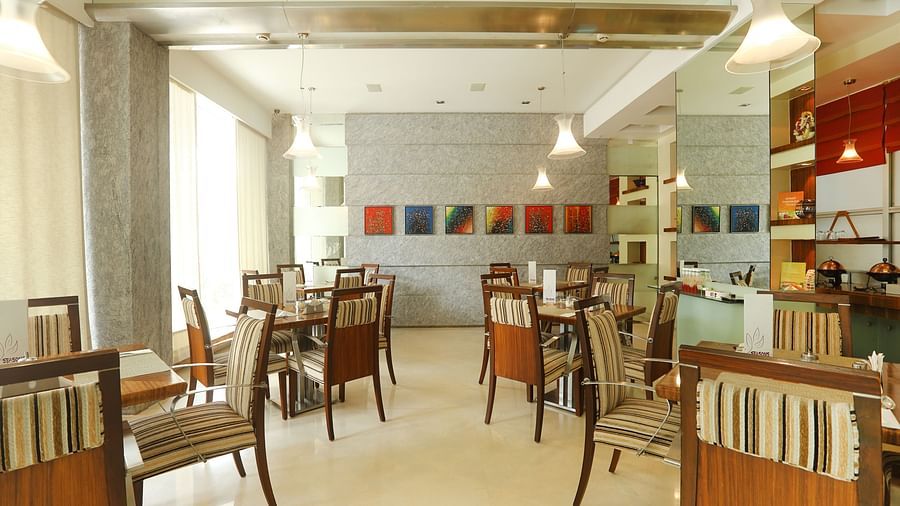 Dining setting of a restaurant at Regency Hotel, Mumbai.