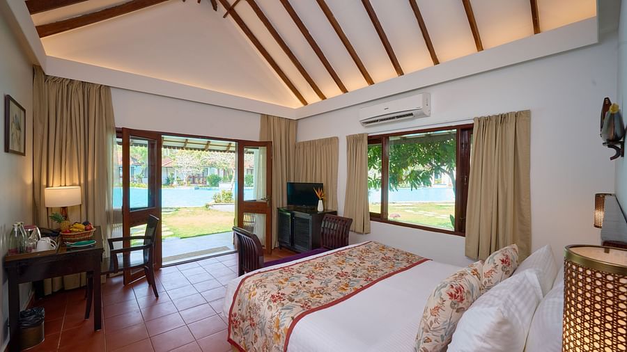 a double bed inside one of the rooms - Rhythm Kumarakom