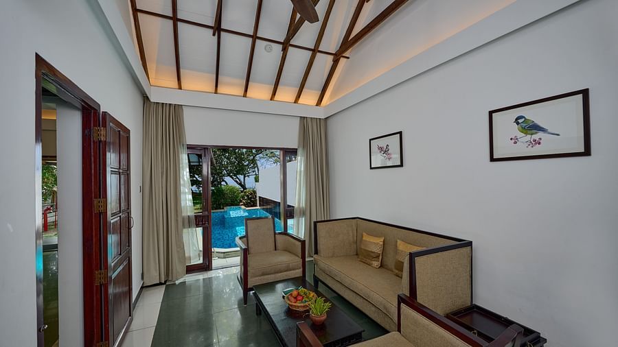 an overview of a living room inside one of the rooms - Rhythm Kumarakom