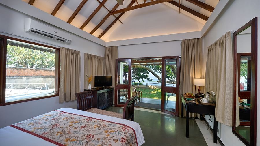 a double bed inside one of the rooms - Rhythm Kumarakom