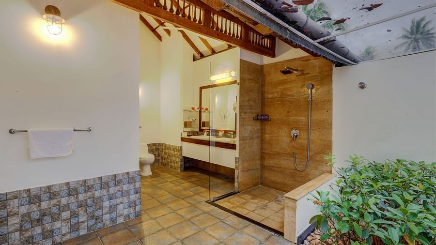an image of an overview of the bathroom inside one of the rooms - Rhythm Kumarakom