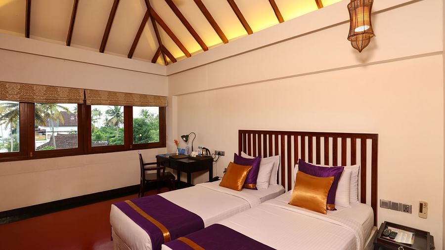 an image of Lake View Terrace Suite Bedroom with twin beds and a huge window - Rhythm Kumarakom