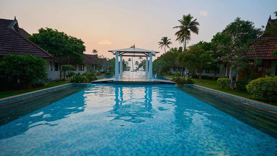india's largest swimming pool with a gazeebo in the centre - Rhythm Kumarakom