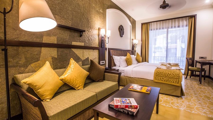 an image of a bedroom with white and gold interiors - Rhythm Lonavala