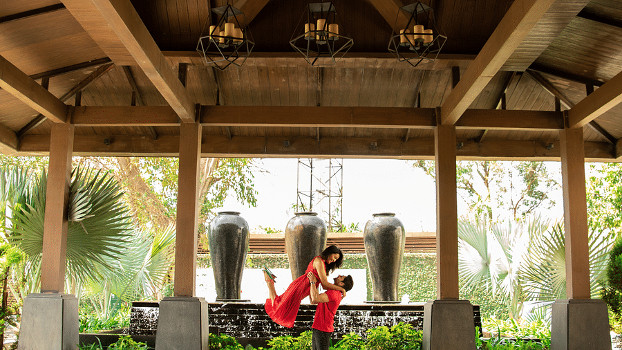 a Couple in red dress celebrating their day- Rhythm Lonavala