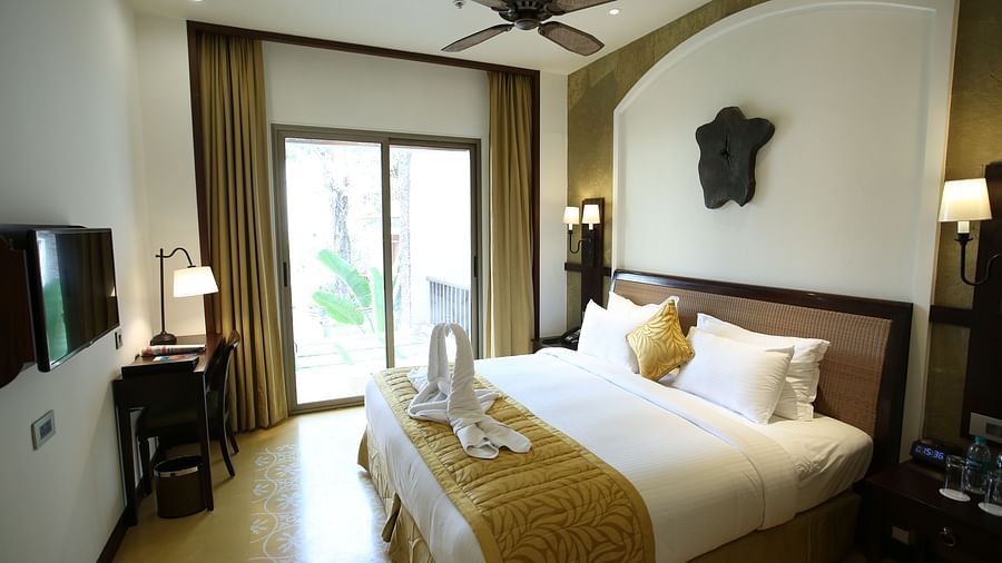 an image of a room with a patio door for a view - Rhythm Lonavala