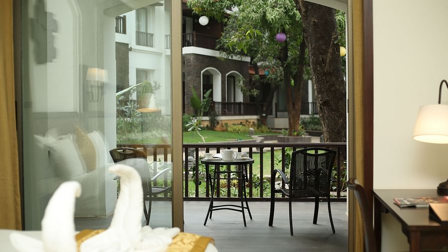 an image of a Patio door opening to the exterior - Rhythm Lonavala