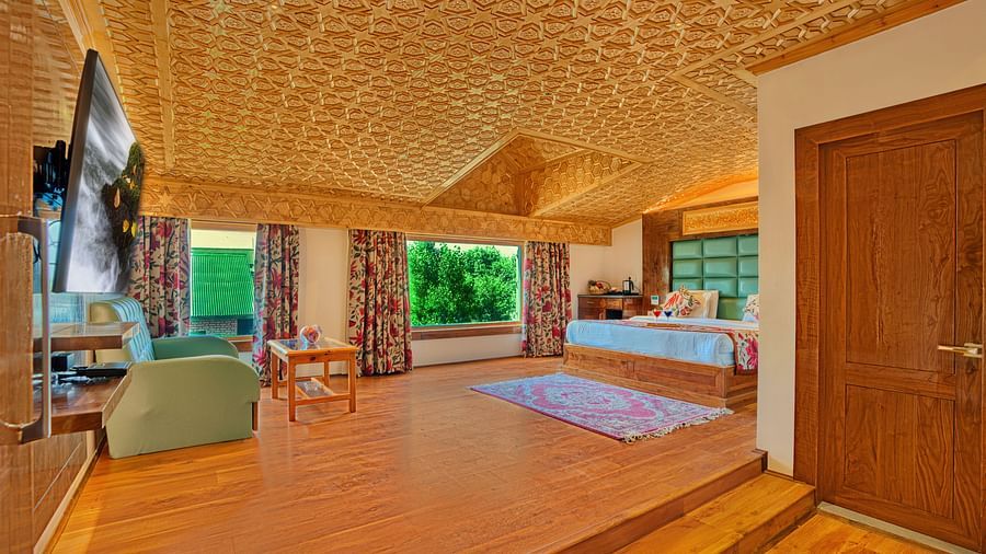 Luxurious room at Royal Comfort Regency with wide open layout and plush furnishings, perfect for extended stays.