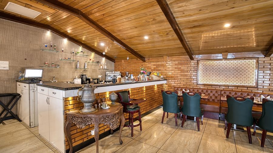 Buffet setup with a sleek serving counter and comfortable seating at Royal Comfort Regency, offering a premium dining experience.