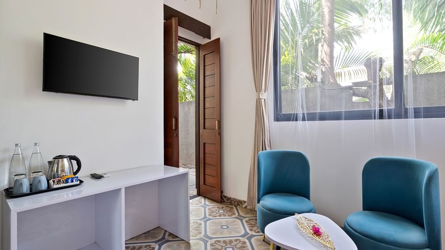 Cosy  decor, a vibrant seating area, and a welcoming ambience.