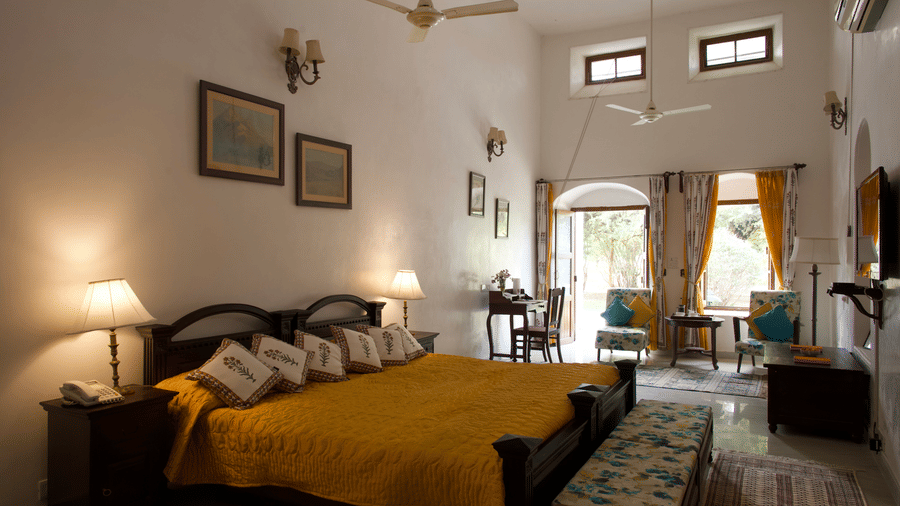 Bright and airy guest room with traditional décor, king-size bed and elegant furnishings at Shahpura Bagh.