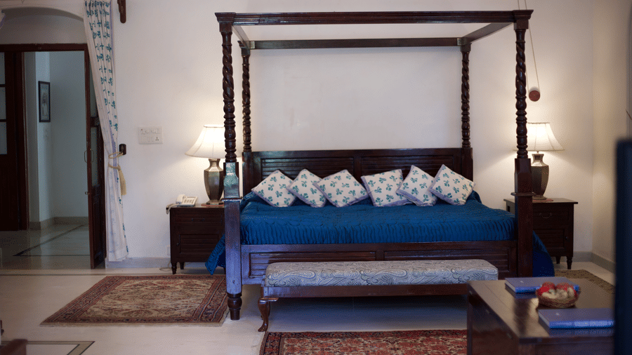 Luxurious four-poster bed in a heritage-style suite with refined interiors at Shahpura Bagh.