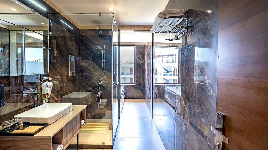 A modern bathroom in the superior room with a separate shower cubicle - Shervani Pebbles & Pines, Corbett