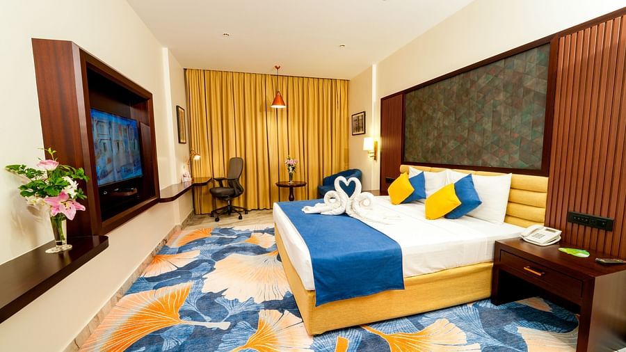 Room at Sitara Luxury Hotel in Hyderabad near Ramoji Film City with a double bed and television