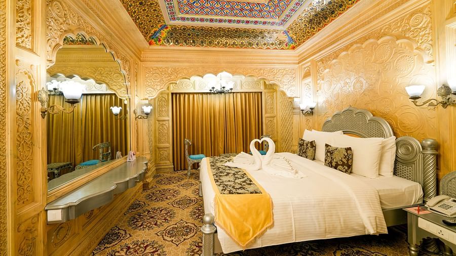 Themed room at Sitara Luxury Hotel in Hyderabad near Ramoji Film City with a king size bed and side tables